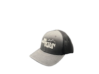 The Charcoal / Black Tucker with BMS Classic White Peak